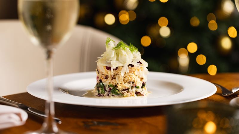 Experience an Italian Christmas in the heart of Mayfair at Theo Randall Cucina Italiana at the InterContinental London Park Lane. Credit: Joe Howard. Image courtesy of InterContinental London Park Lane Tuna tartare and a glass of white wine at Theo Randall at the InterContinental.