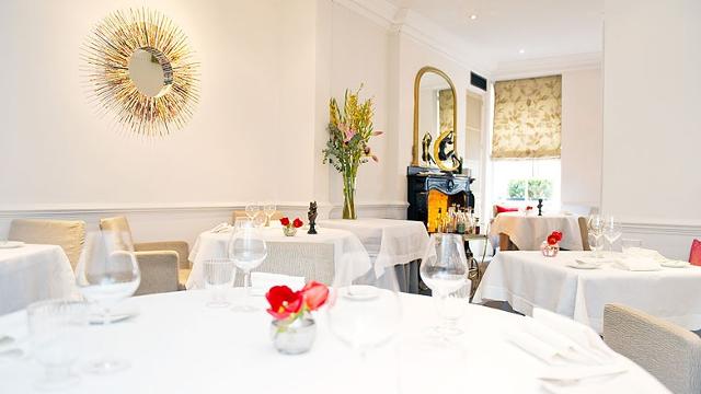 Tuck into delicious French vegan cuisine in elegant surrounds. Image courtesy of Gauthier Soho. The elegant and brightly lit dining room at French restaurant, Gauthier Soho, complete with white tablecloth and white walls.