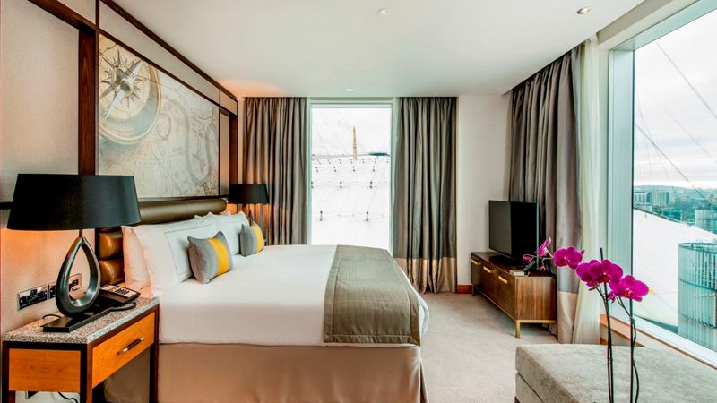 Book a room at The InterContinental London at The O2 to be situated just moments from the iconic venue. Credit: Visit Greenwich. Image courtesy of Visit Greenwich. A photo of a spacious double room at the InterContinental London at The O2 with two windows, one overlooking the venue and another onto the river Thames with views of the city