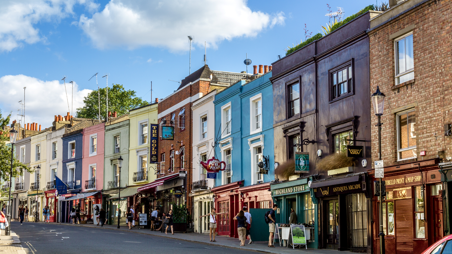 Portobello Market in Notting Hill. Image courtesy of Shutterstock. Colourful buildings along Portobello Road in Notting Hill, west London, on a sunny day