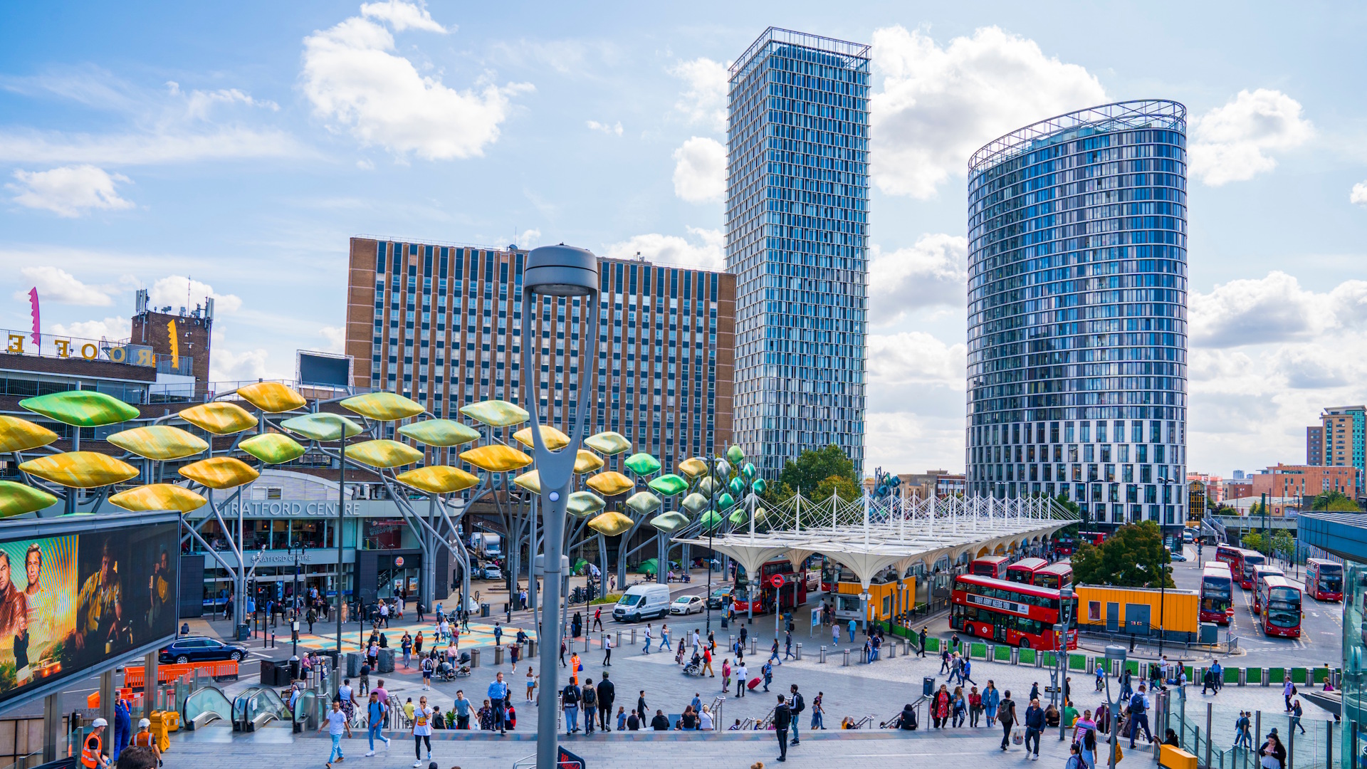 Discover one of the largest urban shopping centres in Europe with a trip to Westfield Stratford City. Credit: Shutterstock. Image courtesy of Shutterstock. Crowds outside Stratford Station and Westfield Stratford City shopping centre, with high-rise buildings, red double-decker buses and blue skies in the background.