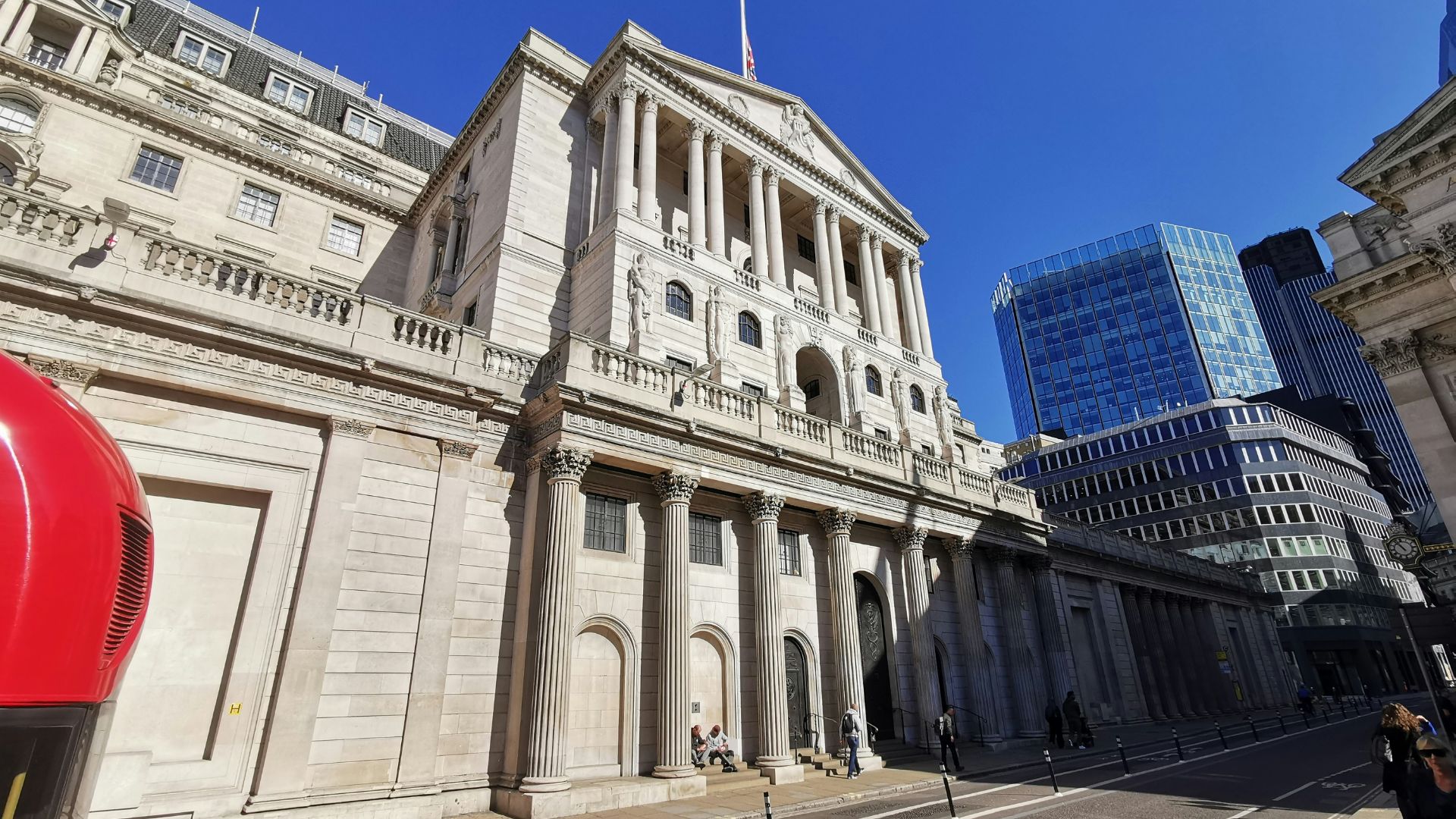 Learn about the history of British currency at the Bank of England Museum. Image courtesy of Unsplash. Exterior of the Bank of England Museum next to tall skyscraper.