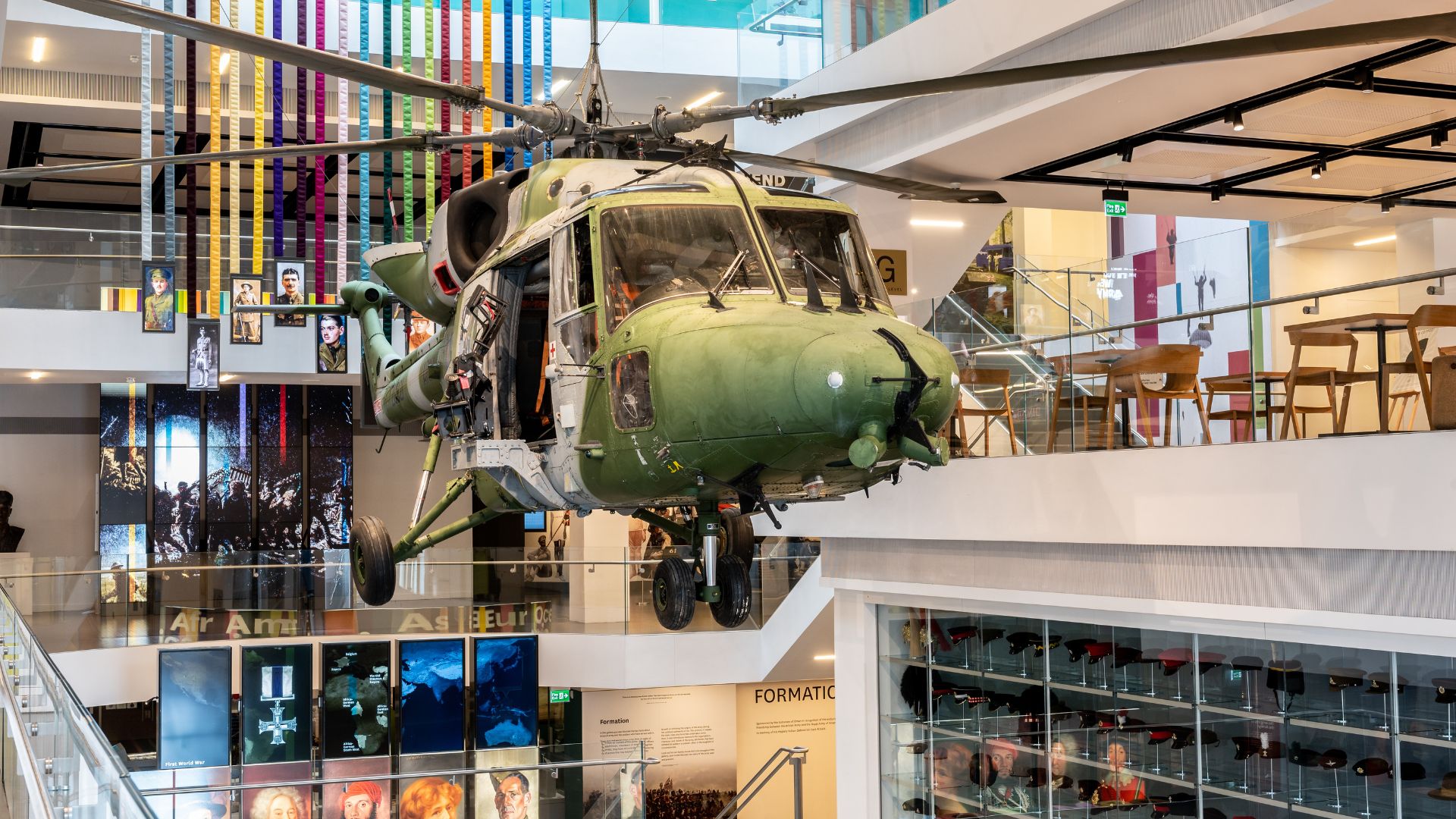 Learn about Britain’s Army at the National Army Museum. Image courtesy of the National Army Museum. Helicopter suspended from ceiling at the National Army Museum.