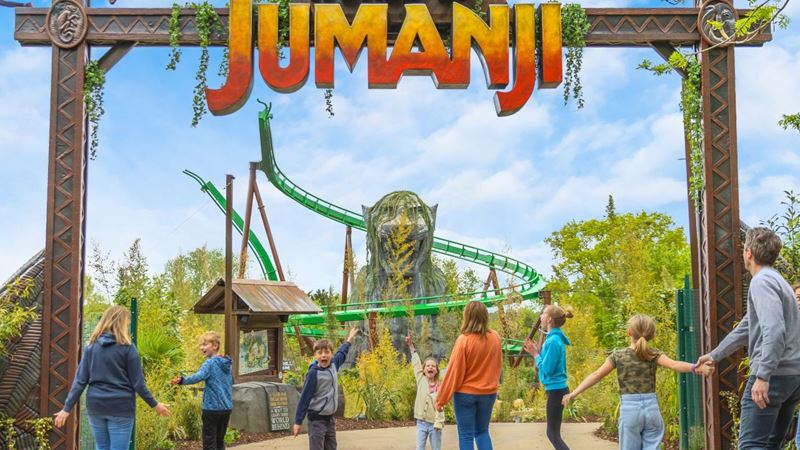 Enter the world of Jumanji at the Chessington World of Adventures resort. Image courtesy of Chessington World of Adventures. Visitors about to enter the World of Jumanji with its rollercoaster in the background, at the Chessington World of Adventures resort.