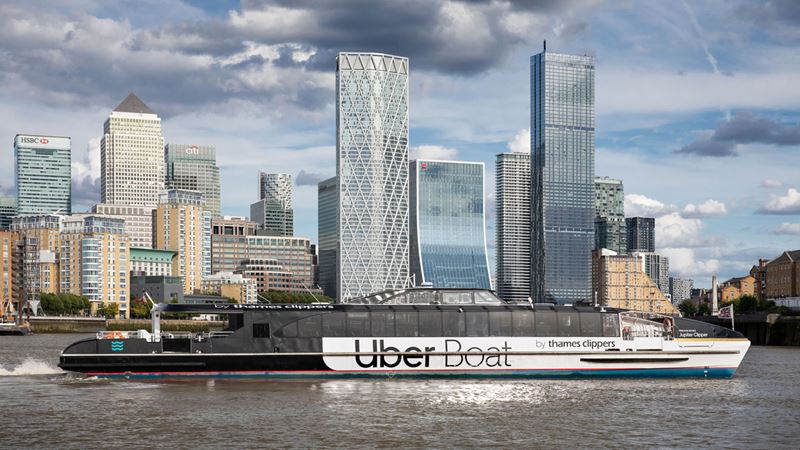 Hop aboard an Uber Thames Clipper boat and see unrivalled panoramas of London from the Thames. Credit: Uber Boat by Thames Clippers. Image courtesy of Uber Boat by Thames Clippers. A sightseeing clipper Uber Boat cruises on the Thames and passes by London financial district Canary Wharf.