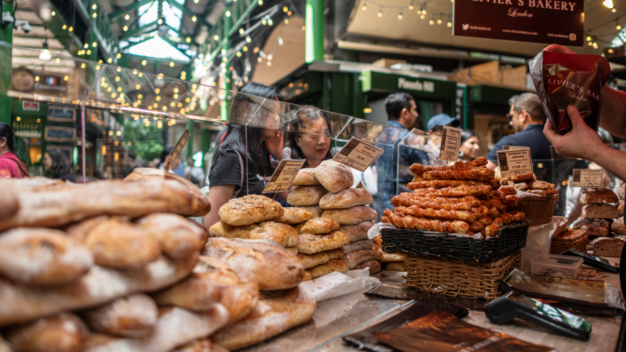 Search for locally sourced goods at Borough Market. Credit: Michael Barrow. Image courtesy of London & Partners. Stacks of freshly baked bread and goodies at a Borough Market stall