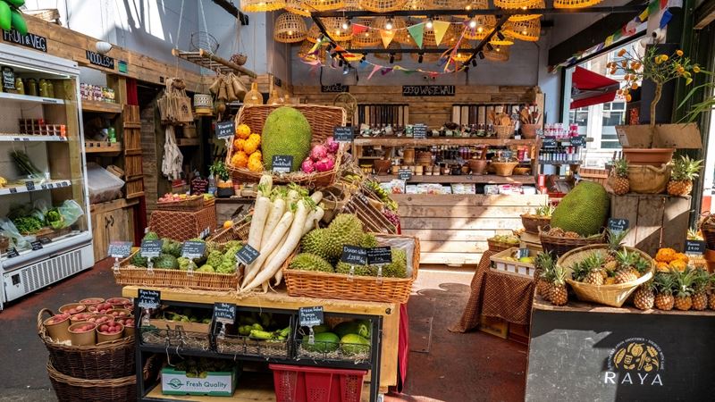 Wander around one of London's most famous markets, filled with street food vendors and locally-sourced produce. Credit: Shutterstock. Image courtesy of Shutterstock. A stall at Borough Market selling a variety of produce including shelves of fruit and vegetables, fridges with fresh ingredients