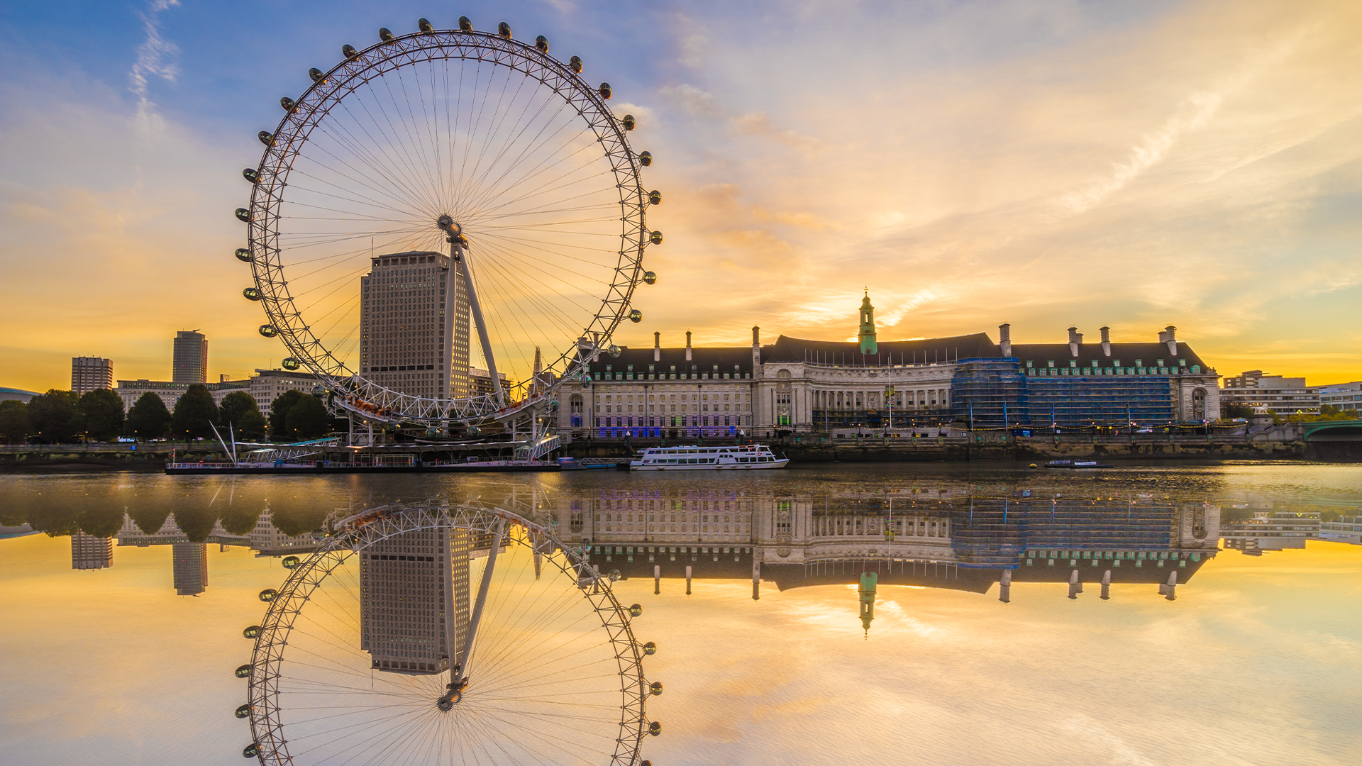 Find out when the UK has bank holidays in 2025. Credit: Shutterstock. Image courtesy of Shutterstock. London Eye reflected on the river Thames during sunrise