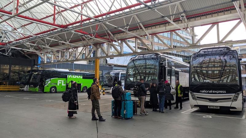Coaches can provide a cheaper method to travel to London from nearby locations. Travel to and from London quickly with the Eurostar. Credit: Shutterstock. Image courtesy of Shutterstock. A photo of multiple people with luggage queuing to board a coach at a London coach station