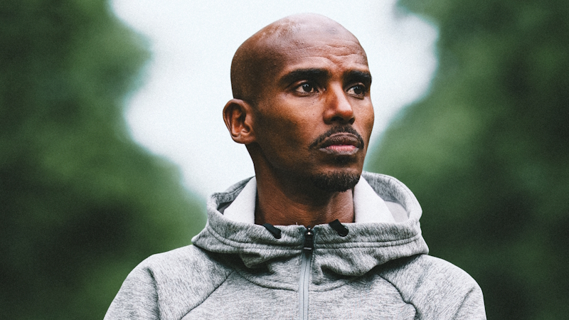 Join Mo Farah on a 3k run as part of BST Hyde Park's Open House series of events this summer. Image courtesy of Outside Organisation. A close-up photograph of Mo Farah's head and shoulders, wearing a grey hoodie.