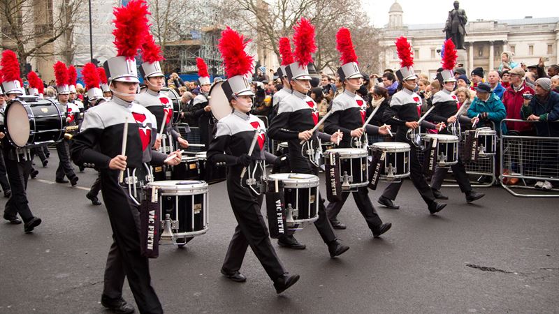 See marching bands and floats at London's New Year's Day Parade. Image courtesy of Shutterstock. A young marching band plays in the street during London's New Year's Day Parade.