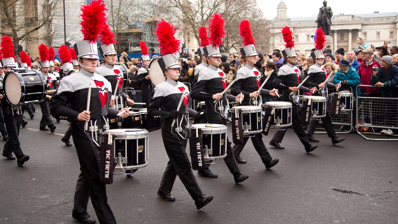 See marching bands and floats at London's New Year's Day Parade. Image courtesy of Shutterstock. A young marching band plays in the street during London's New Year's Day Parade.