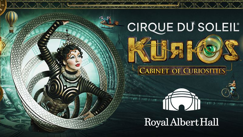 Catch the spectacular Cirque du Soleil circus show, KURIOS – A Cabinet of Curiosities, which celebrates the company's 30 years at the Royal Albert Hall this January. Image courtesy of London Theatre Direct. This is the artwork for the Cirque du Soleil show, KURIOS, to be presented at the Royal Albert Hall. It shows a woman dressed in a black-and-white patterned bodysuit emerging from a series of iron circles that resemble an interdimensional portal.