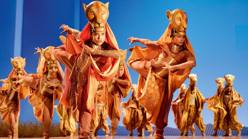 Entertain the whole family with a trip to see The Lion King musical. Credit: Deen van Meer. Image courtesy of Disney. Dancers performing the lioness hunt on stage at the Lion King musical