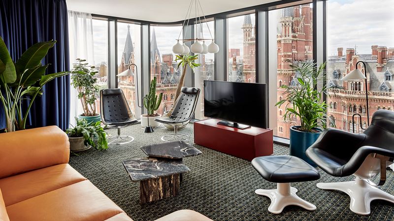 Discover vibrant interiors and stunning views of the city from The Standard, London. Credit: Mercy Amankwe. Image courtesy of The Standard. The quirky interiors of a room at The Standard, London with views of the St Pancras International Railway Station.